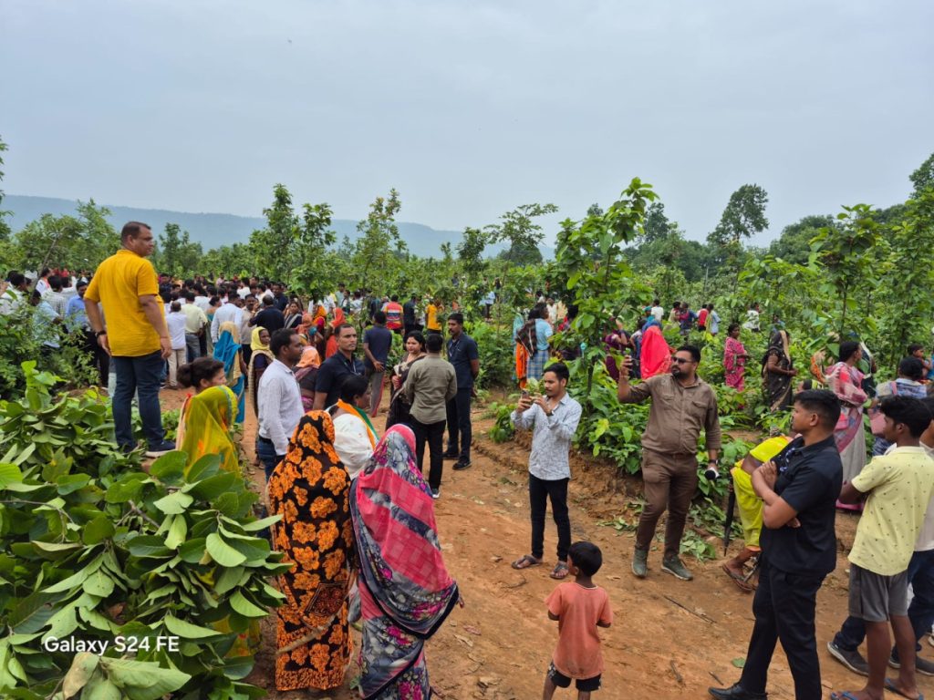 Villagers gather at the site of tree felling in Mudagaon on June 27