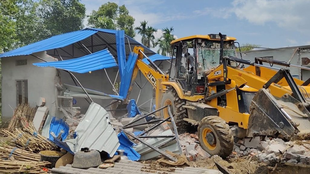 A massive eviction drive underway at the proposed site of a 3,400-MW thermal power plant in the Bilashipara area of Dhubri district. Photo: Special arrangement
