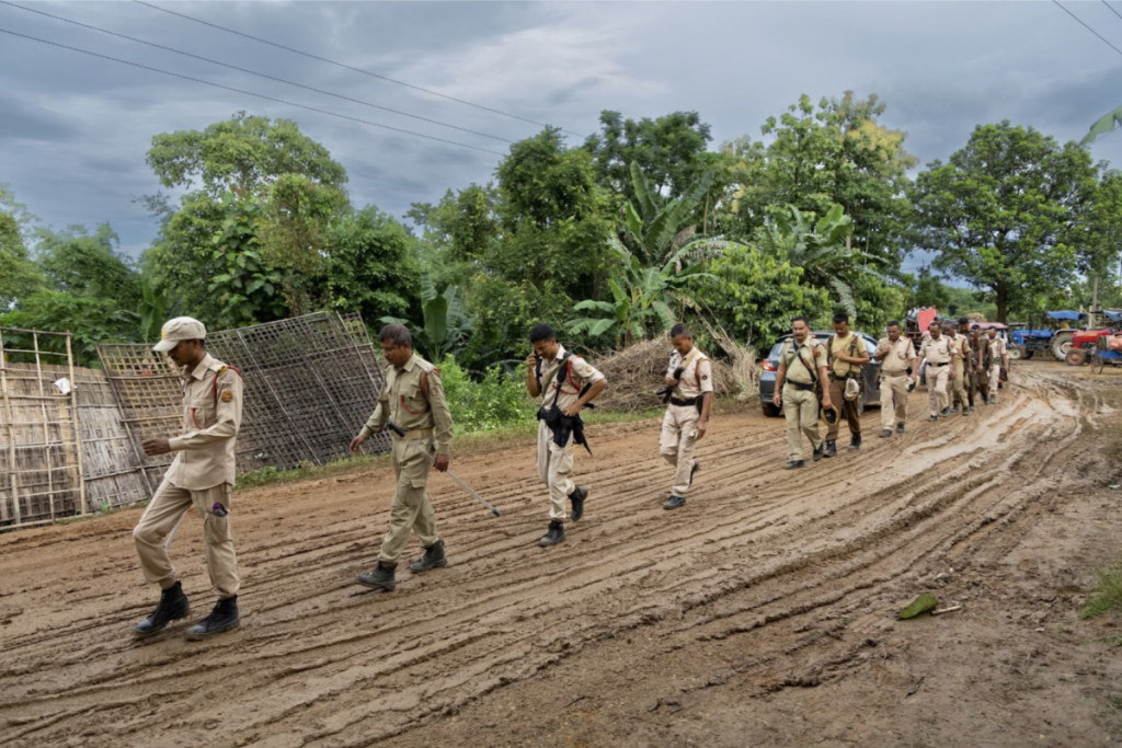 Police patrol in Charuabakhra village during the evacuation at the proposed thermal power plant site in Dhubri, Assam, on July 5. Photo: Kazi Sharowar Hussain