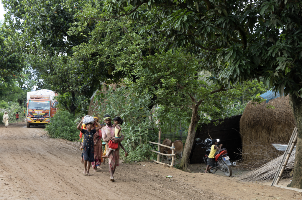 Residents of Chirakuta village carrying their belongings as they vacate their homes following the eviction notices in Dhubri, Assam, on July 5. Photo: Kazi Sharowar Hussain