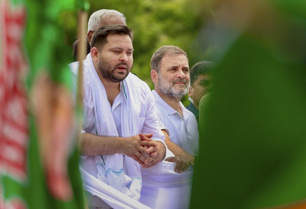 RJD leader Tejashwi Yadav with Rahul Gandhi during the protest march. Photo: AICC/PTI