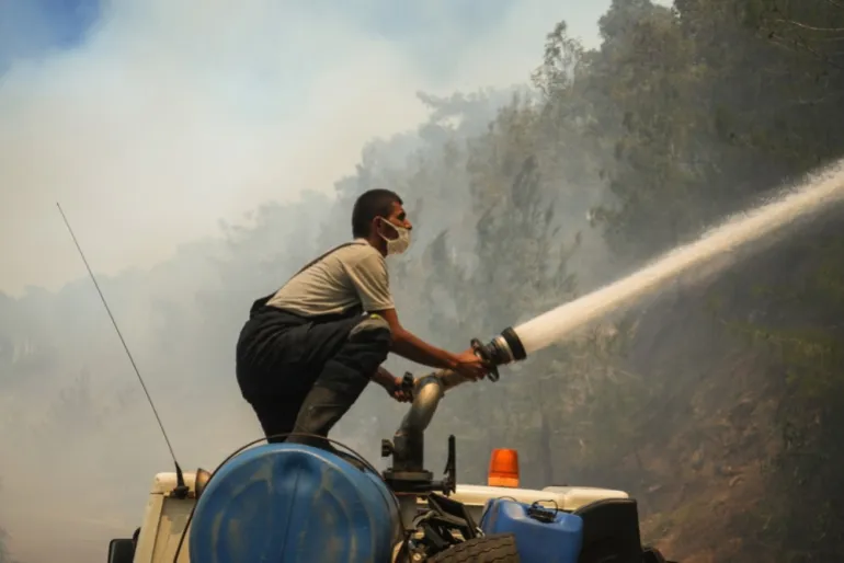 A firefighter at the site of a wildfire in Qastal Maaf, Latakia, on July 5, 2025