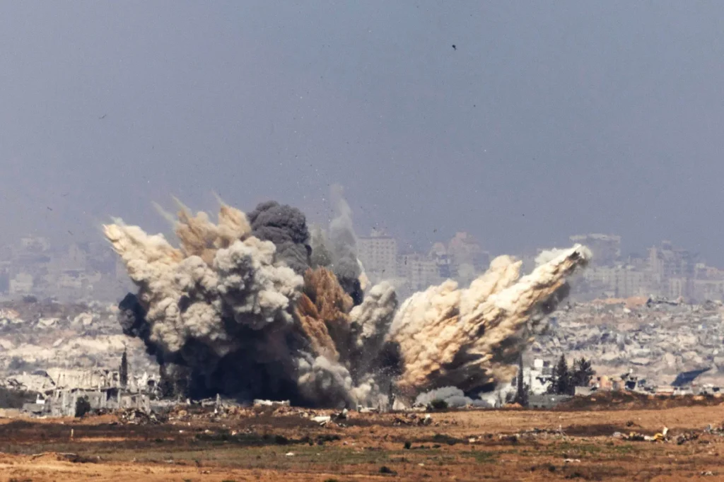 Smoke and debris rises following an Israeli airstrike in northern Gaza near Beit Hanoun on Thursday.