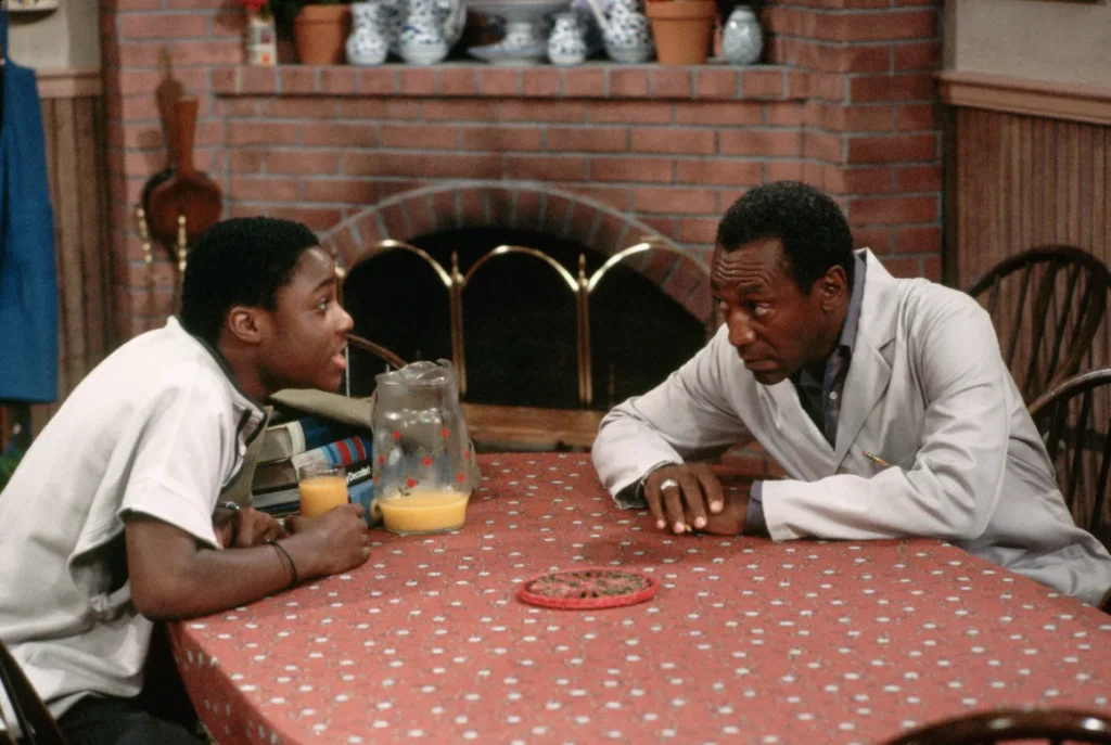 Warner and Bill Cosby in a scene from the "Cosby Show."