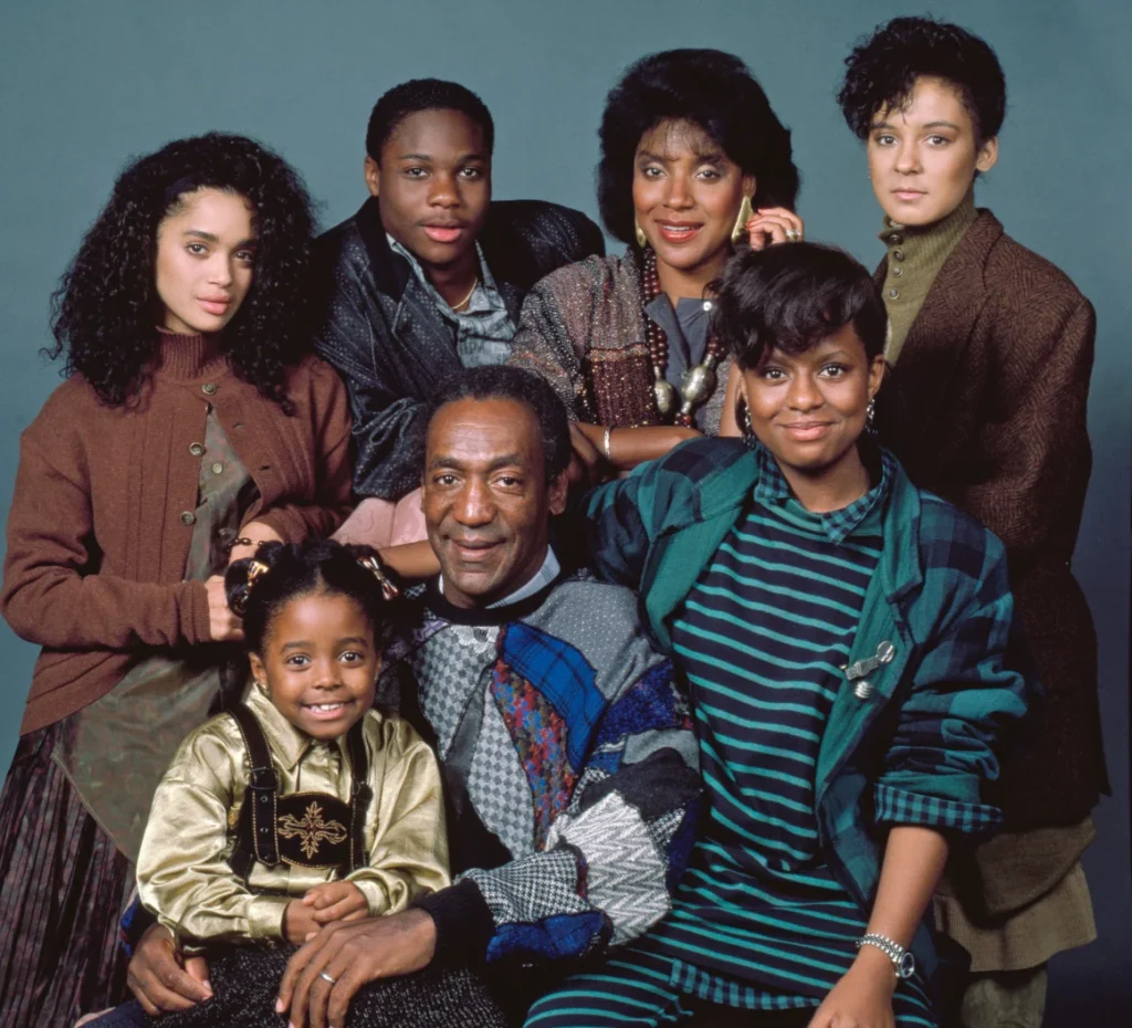 Warner poses with the cast of "The Cosby Show."
