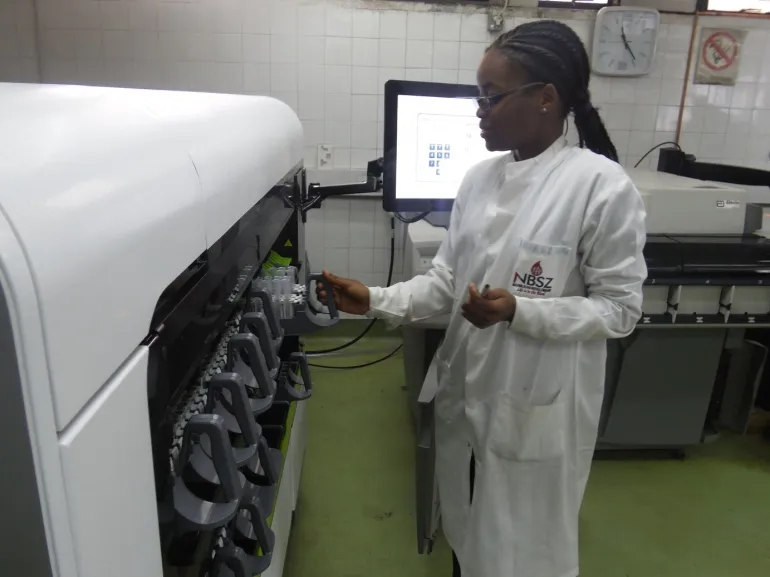 A woman works at a National Blood Service Zimbabwe