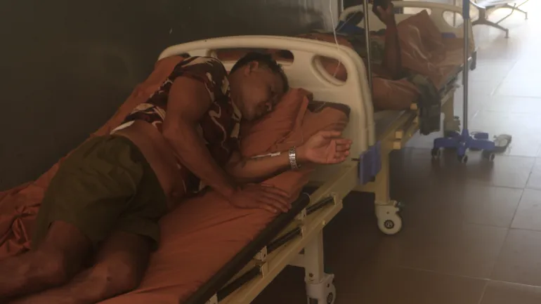 Injured Cambodian soldiers wait in a hospital corridor to receive treatment in Cambodia’s Oddar Meanchey province on Friday