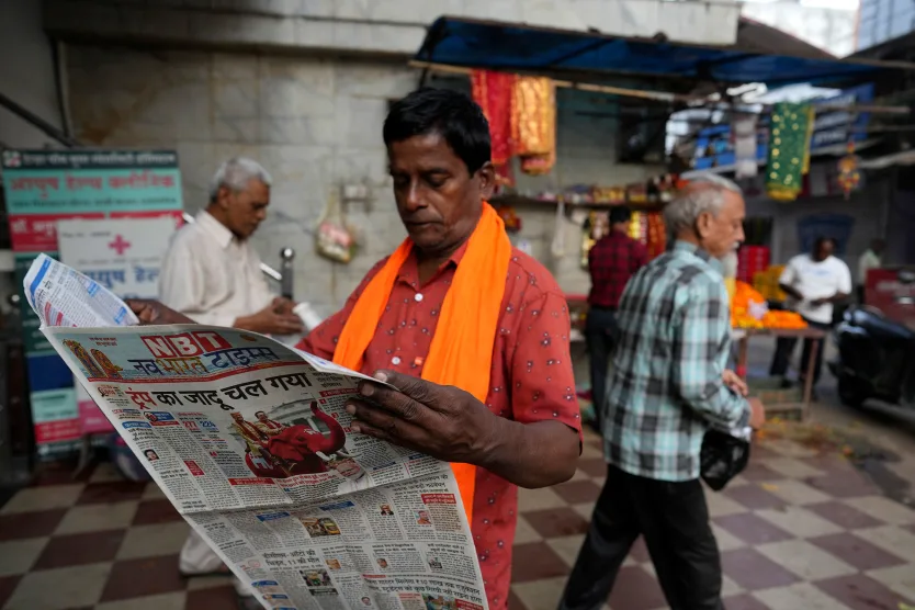A man reads a Hindi-language newspaper in Lucknow, Uttar Pradesh, India, in November 2024.
