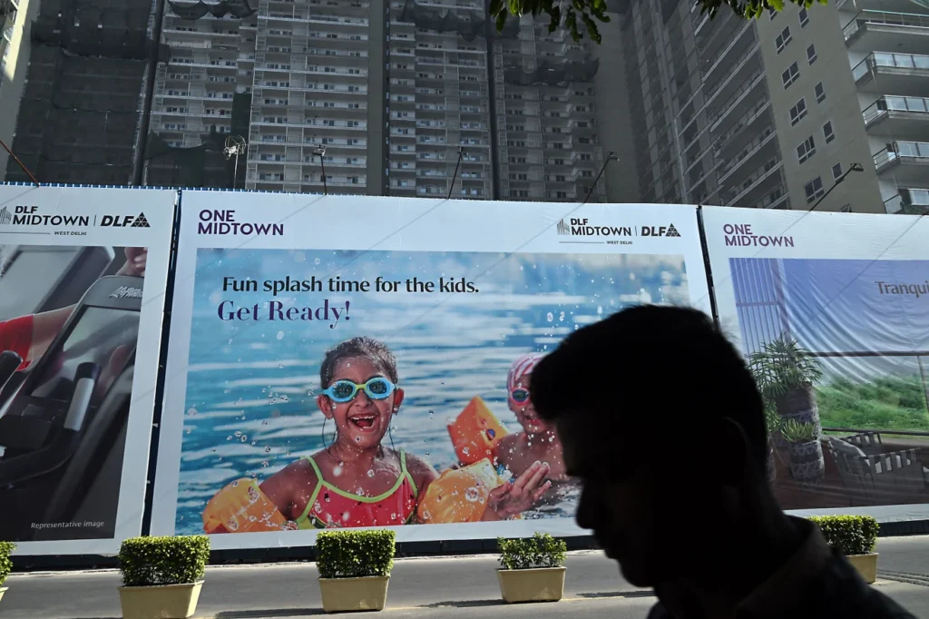 English-language signage appears at the construction site of a new residential building in New Delhi, in December 2023.