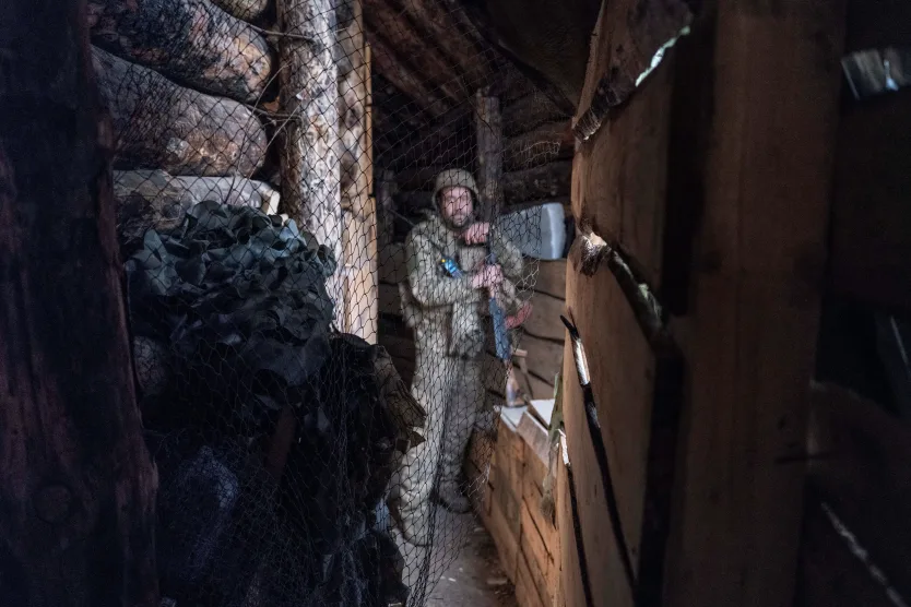 A serviceman of the 93rd Kholodnyi Yar Separate Mechanized Brigade stands behind a net protecting from Russian combat drones, at an anti-drone firing positions in the frontline city of Kostyantynivka, Donetsk region, Ukraine, on April 24.