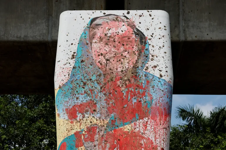 A mural of Hasina vandalised by protesters in Dhaka, August 5, 2024