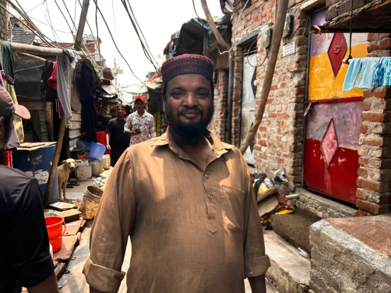 ‘The garbage grows, and we keep working.’ Shah Alam, a Delhi waste picker who also drives an electric rickshaw