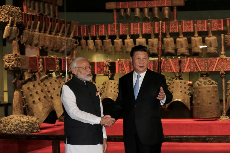 Chinese President Xi Jinping and Indian Prime Minister Narendra Modi shake hands as they visit the Hubei Provincial Museum in Wuhan, Hubei province, China, April 27, 2018