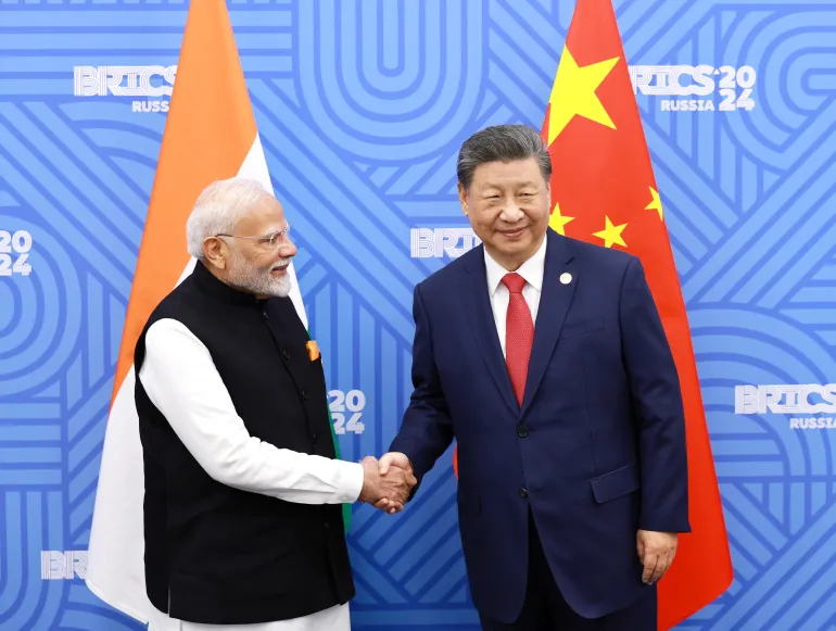 Chinese President Xi Jinping, right, and Indian Prime Minister Narendra Modi meet on the sidelines of a BRICS summit in Kazan, Russia, October 23, 2024