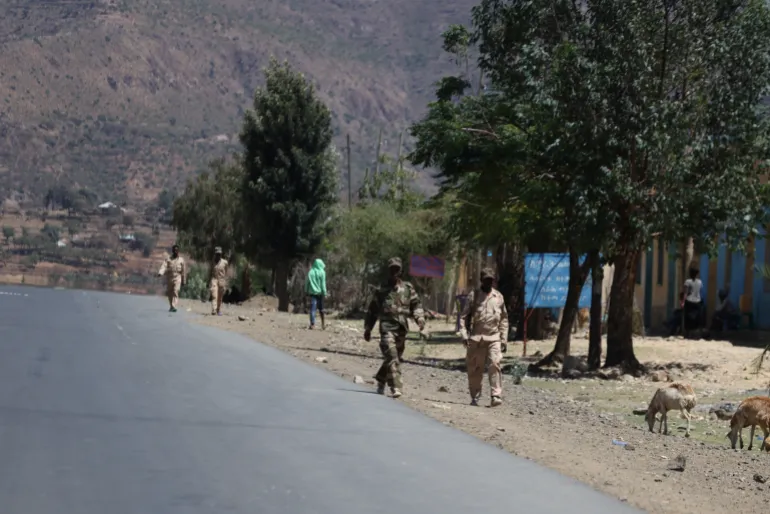 Troops in Eritrean uniforms walk near the town of Adigrat, Ethiopia, March 18, 2021
