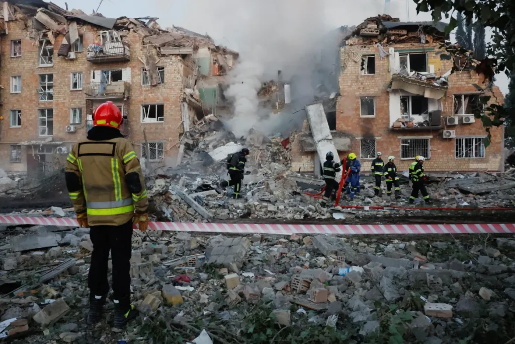 Amid the destruction, emergency responders searched for survivors and pulled out bodies. Crowds of residents stood nearby, waiting for relatives to be retrieved from the rubble. 