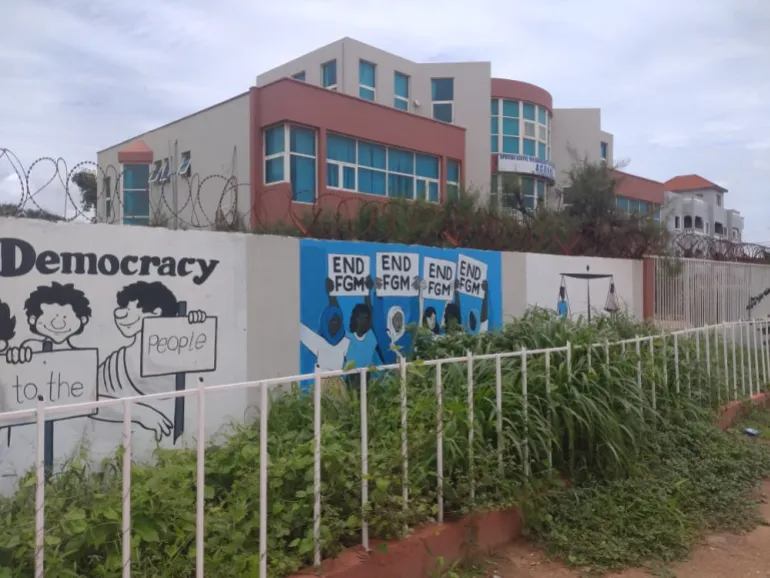 A wall mural reads ‘END FGM’ in Banjul, The Gambia