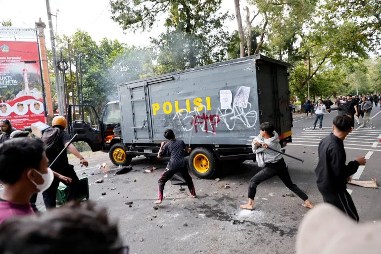 Protesters clash with police outside the parliament building in Denpasar, Bali, Indonesia, on August 30, 2025