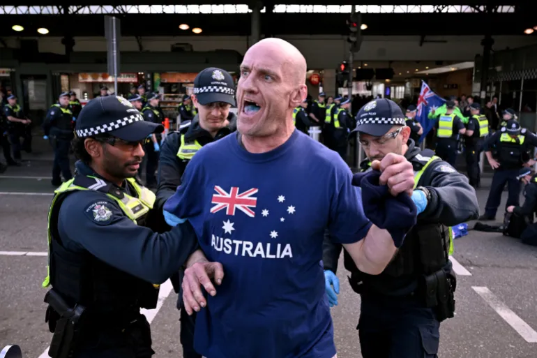 Police arrest a protester during the “March for Australia” anti-immigration rally in Melbourne on August 31, 2025