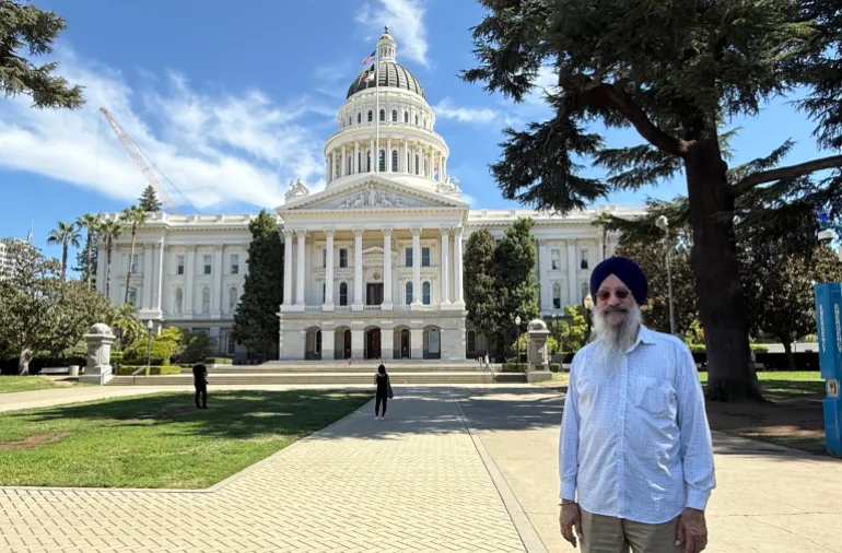Gurtej Singh Cheema in front of the State Capitol complex in Sacramento