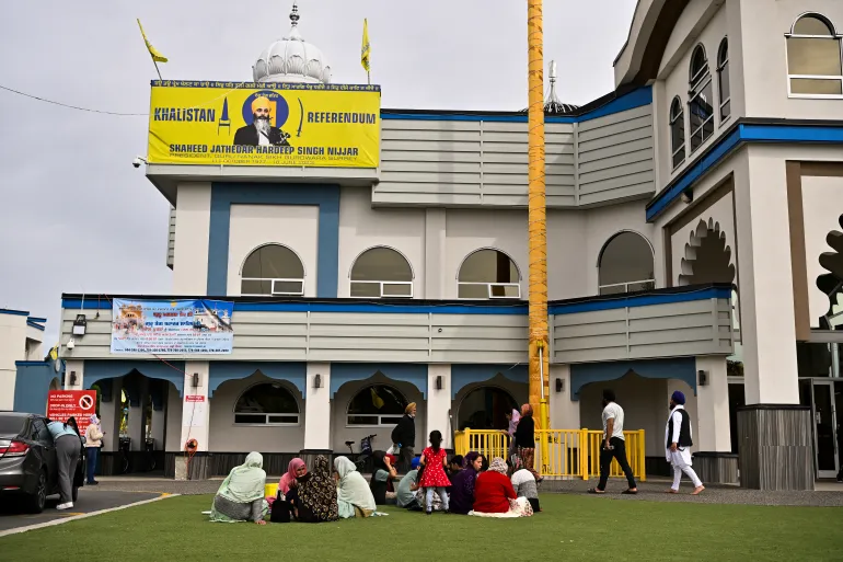 People gather at Guru Nanak Sikh Gurdwara, site of the 2023 murder of Sikh separatist leader Hardeep Singh Nijjar, in Surrey, British Columbia, Canada, on May 3, 2024