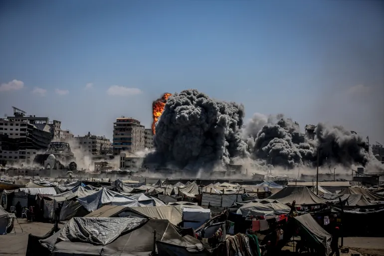 Smoke rises from the Harmony Tower right after being bombed by Israeli forces in western Gaza City on September 10