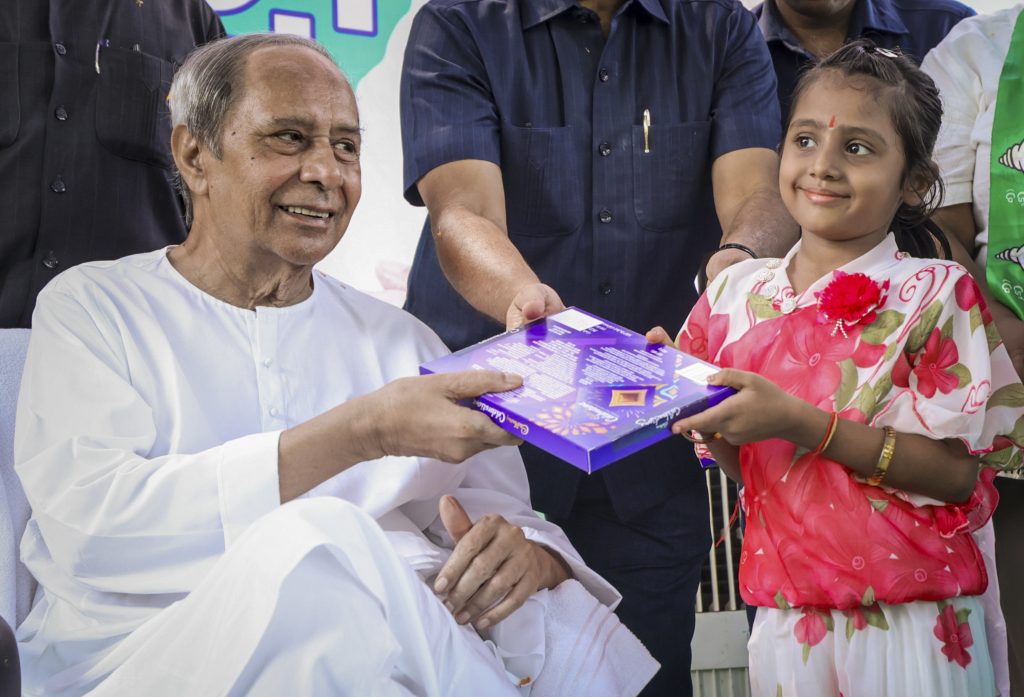 Biju Janata Dal (BJD) chief Naveen Patnaik distributes chocolates to a child he celebrates his 79th birthday at SOS Children’s Village NGO, in Bhubaneswar, Odisha, Thursday, Oct. 16, 2025